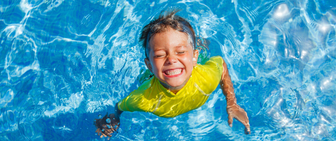 smiling child swimming