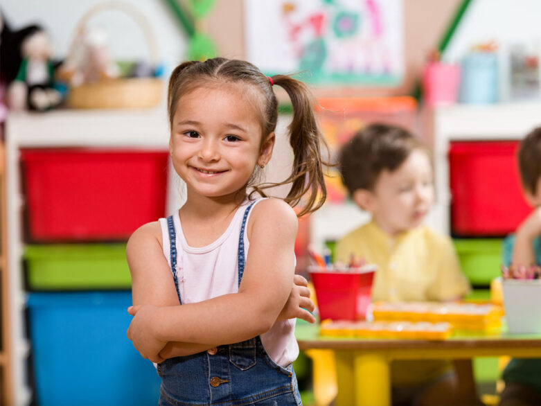 little girl smiling at Alexa's PLAYC